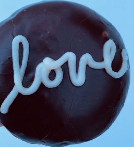 Marshmallow cream with chocolate glaze and buttercream "love" written on top
